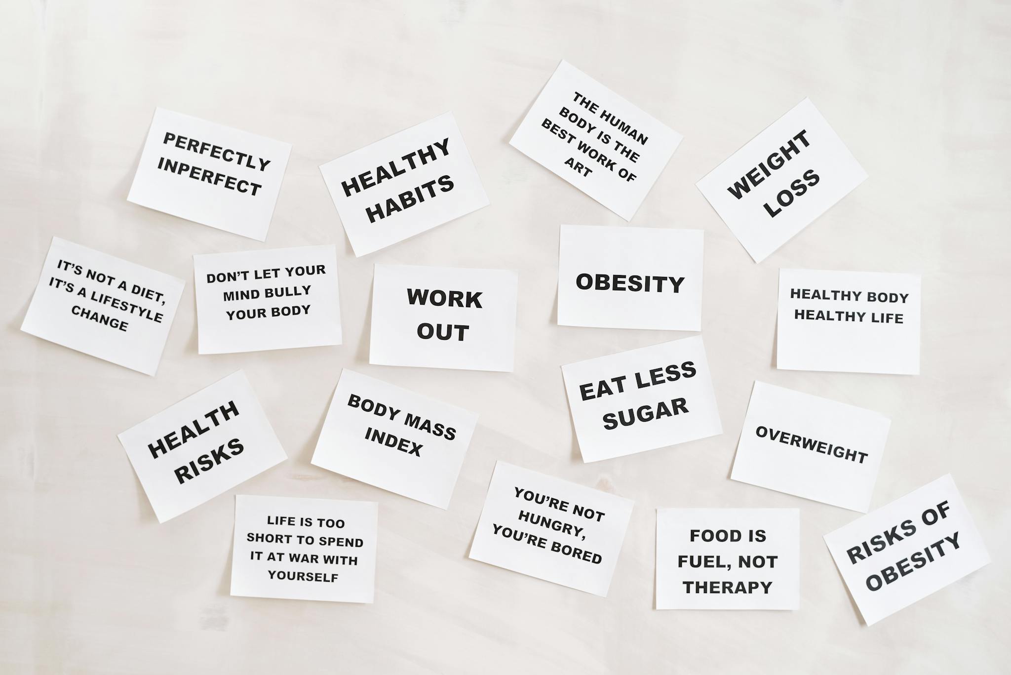Collection of motivational health and fitness messages on white cards, promoting a healthy lifestyle.